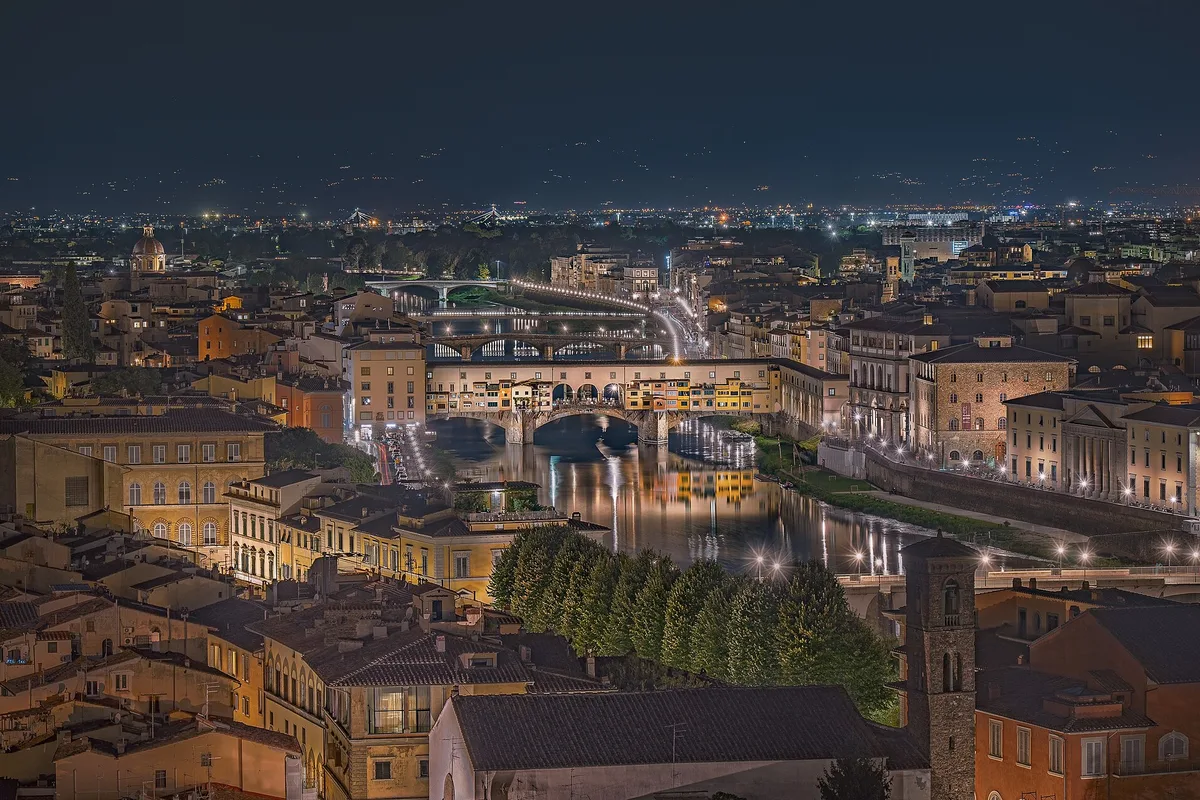 Florence at dusk, when the Rificolona lantern procession crosses the city