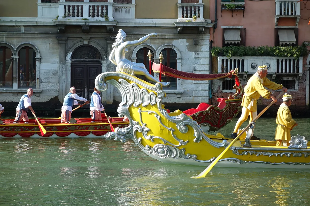 Decorated boats and rowers at the Regata Storica in Venice