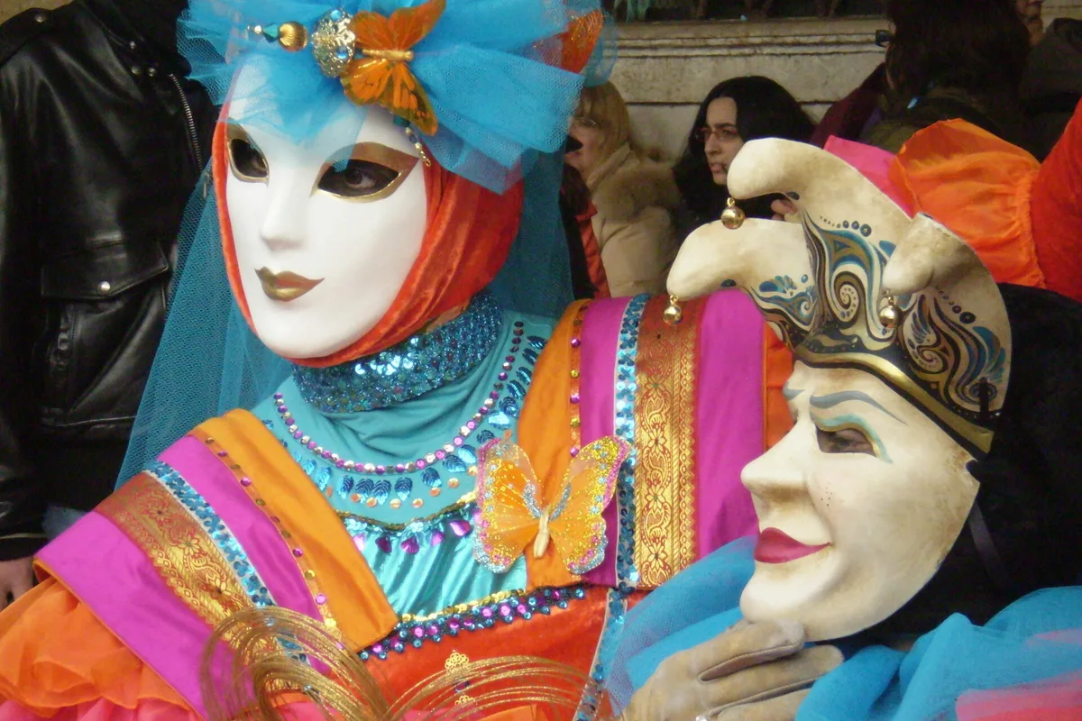 Masked and costumed figures at the Venice Carnival