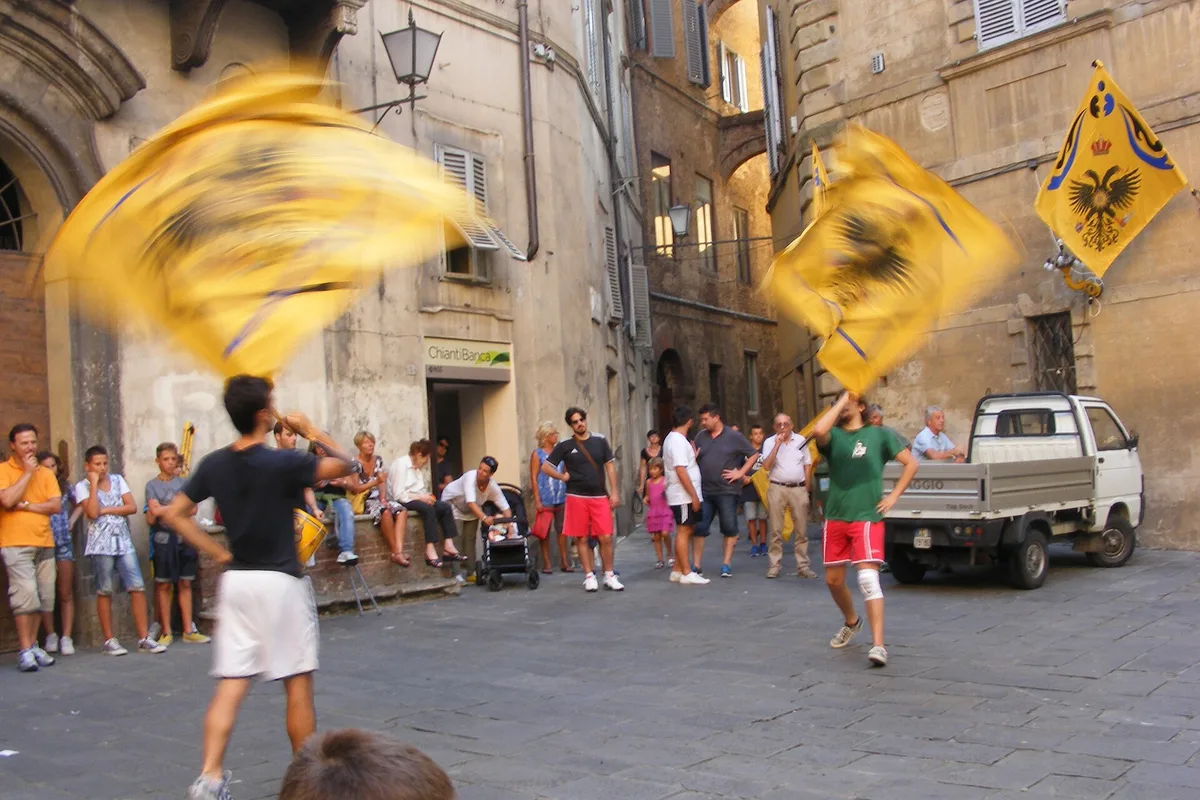 A contrada emblem on a street in Siena