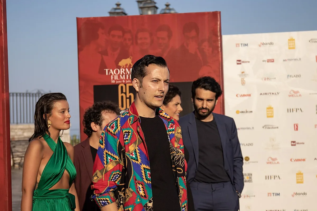Teatro Antico di Taormina hosting an outdoor film festival screening at dusk, Italy — 1