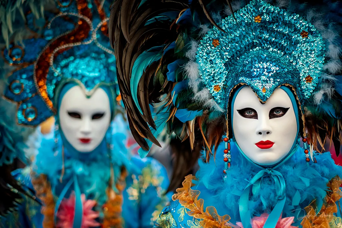 Costumed figures at the Venice Carnival